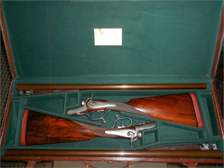 A PAIR OF CASED 12 BORE PURDEY SHOTGUNS WITH FULL PROVENANCE